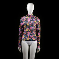 Istay - Blouse - Multicolored - Size S - Fitted long sleeve top with a mock neck and all-over vibrant floral print on a dark background. The garment is semi-sheer and features a high neckline with no visible closures.