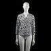 Savinni - Blouse - White & Black - Size S - Long-sleeve blouse with a V-neckline and an all-over irregular black spot print. Features sleeves with button tab detailing near the cuffs.