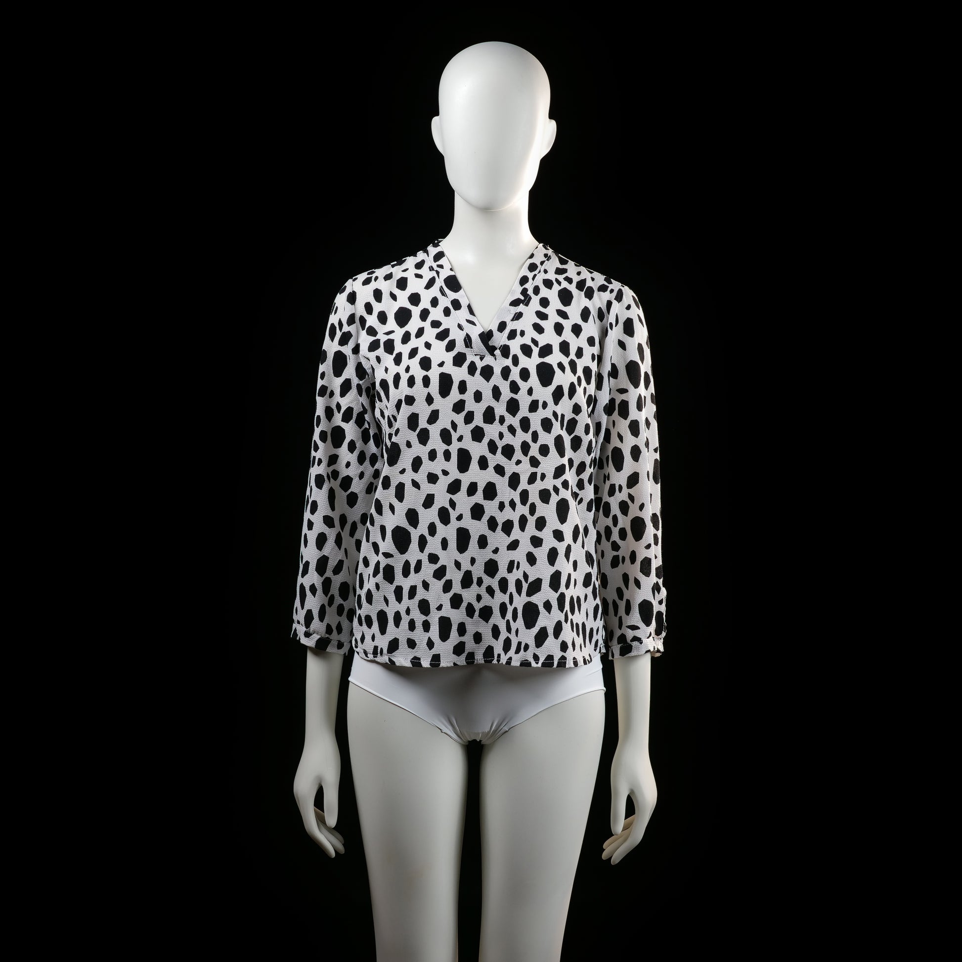 Savinni - Blouse - White & Black - Size S - Long-sleeve blouse with a V-neckline and an all-over irregular black spot print. Features sleeves with button tab detailing near the cuffs.
