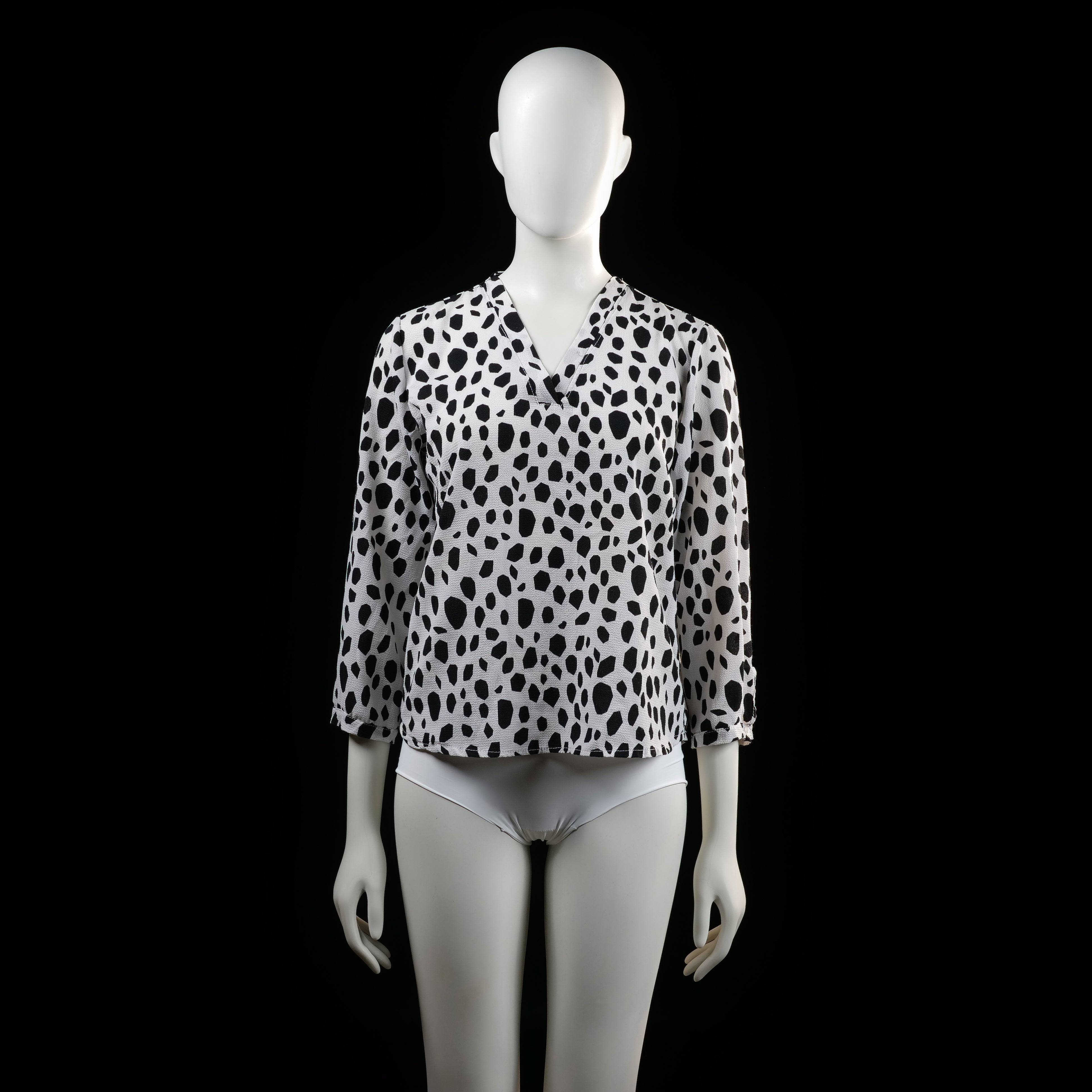 Savinni - Blouse - White & Black - Size S - Long-sleeve blouse with a V-neckline and an all-over irregular black spot print. Features sleeves with button tab detailing near the cuffs.
