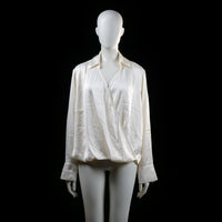 H&M - Bodysuit - Ivory - Size L - Long-sleeve bodysuit featuring a draped wrap-style front, pointed collar, and wide cuffs with buttons. The bottom portion is a fitted brief style, indicating it's a bodysuit rather than a standard blouse.