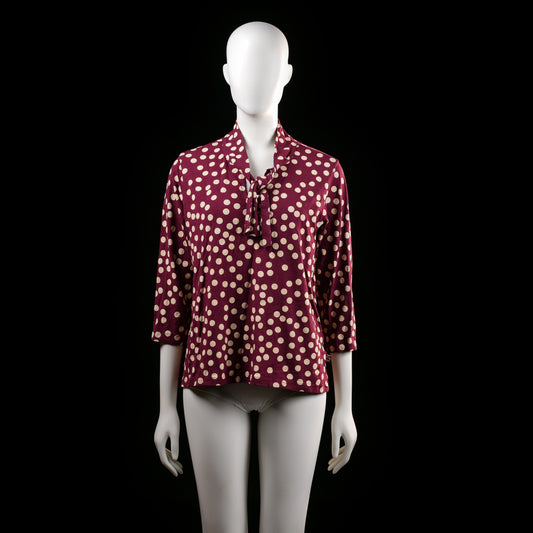 Danefæ - Blouse - Burgundy & Ivory - Size M - Polka dot top featuring a V-neckline with a tie detail and three-quarter sleeves. Burgundy base with an allover ivory dot pattern.