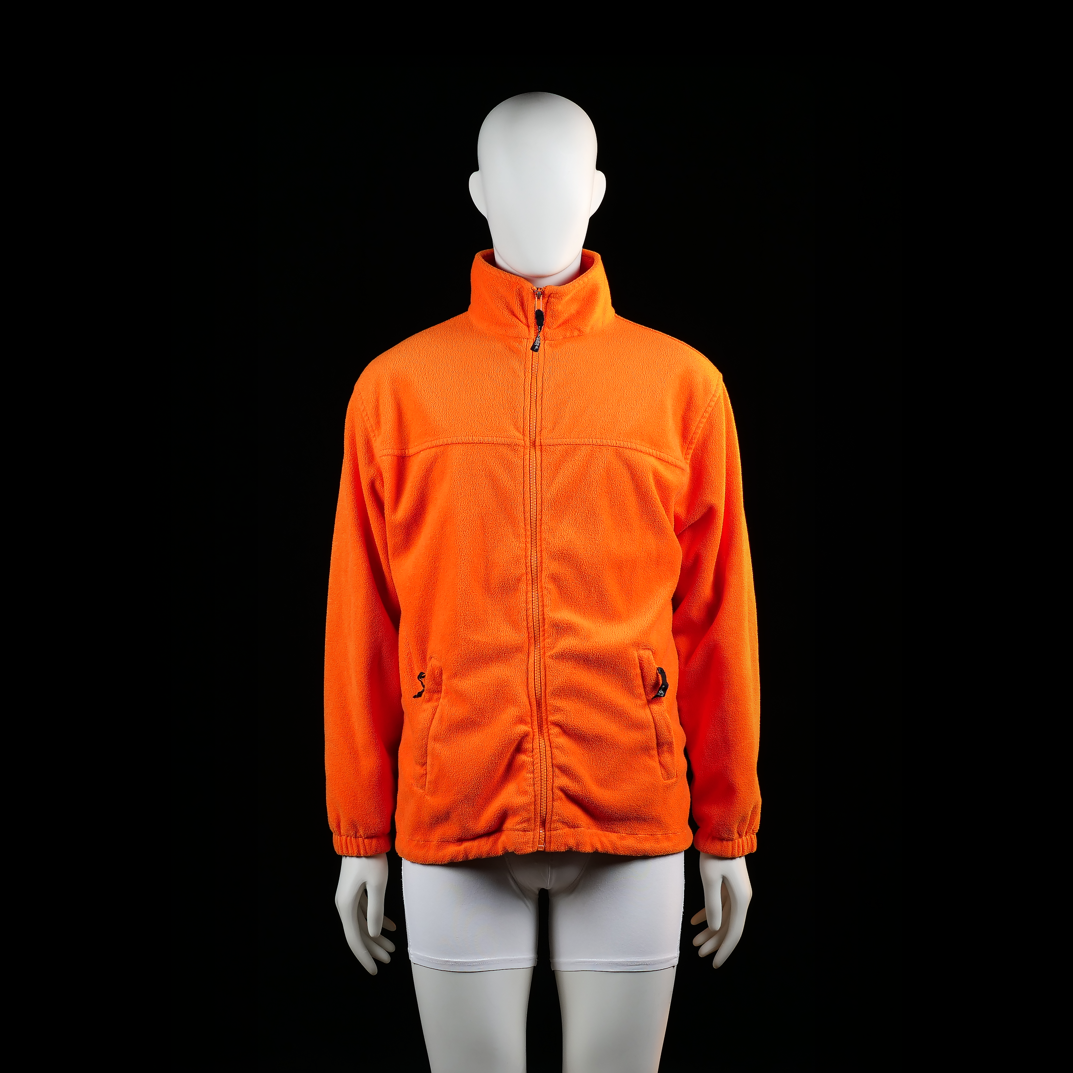 James & Nickolson - Fleece jacket - Orange - Size L - High-neck fleece jacket with full front zip closure and elasticated cuffs. Features two zippered side pockets and a straight hem.