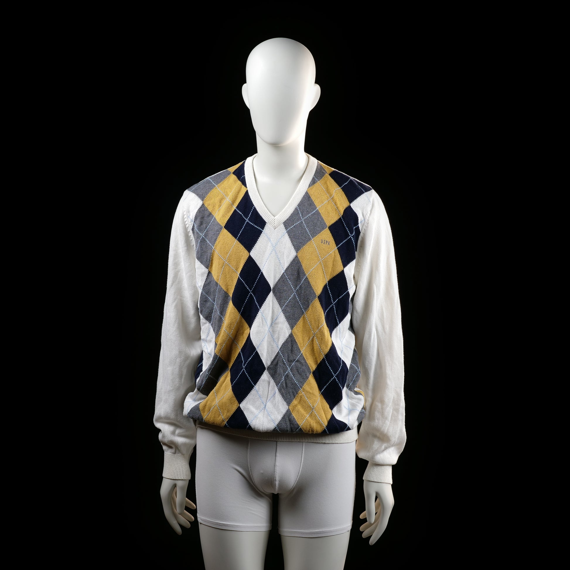 U.S. Polo Assn - Sweater - Multicolored - Size L - Long-sleeve sweater with a ribbed V-neckline and cuffs. The front features a bold argyle pattern in navy, mustard yellow, white, and gray, while the back and sleeves are solid white.