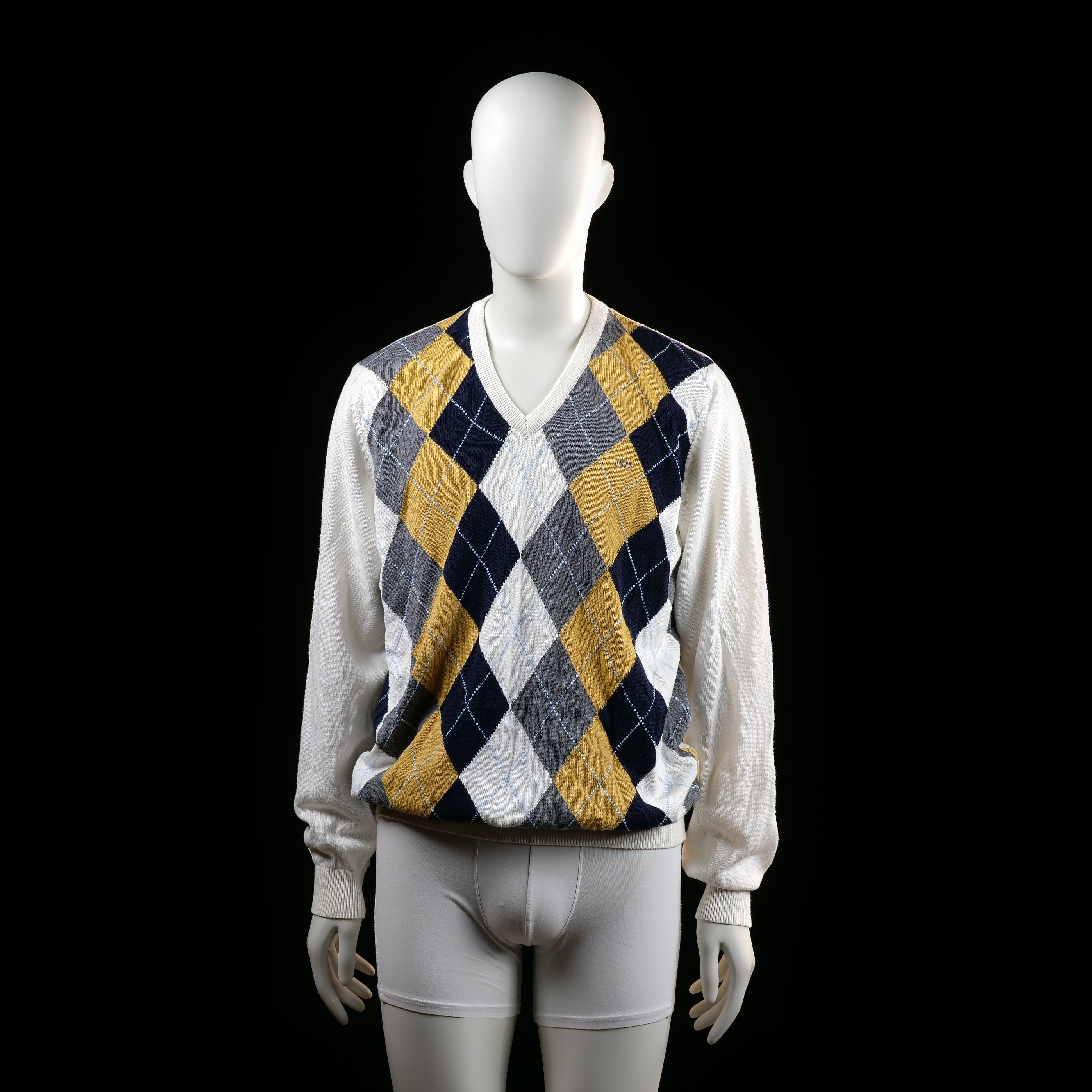 U.S. Polo Assn - Sweater - Multicolored - Size L - Long-sleeve sweater with a ribbed V-neckline and cuffs. The front features a bold argyle pattern in navy, mustard yellow, white, and gray, while the back and sleeves are solid white.