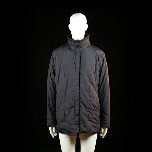 C&A Canda - Padded jacket - Black - Size 46 - Hip-length padded jacket with a high stand collar and concealed front zipper closure. Minimal stitching details are visible along the body and sleeves.