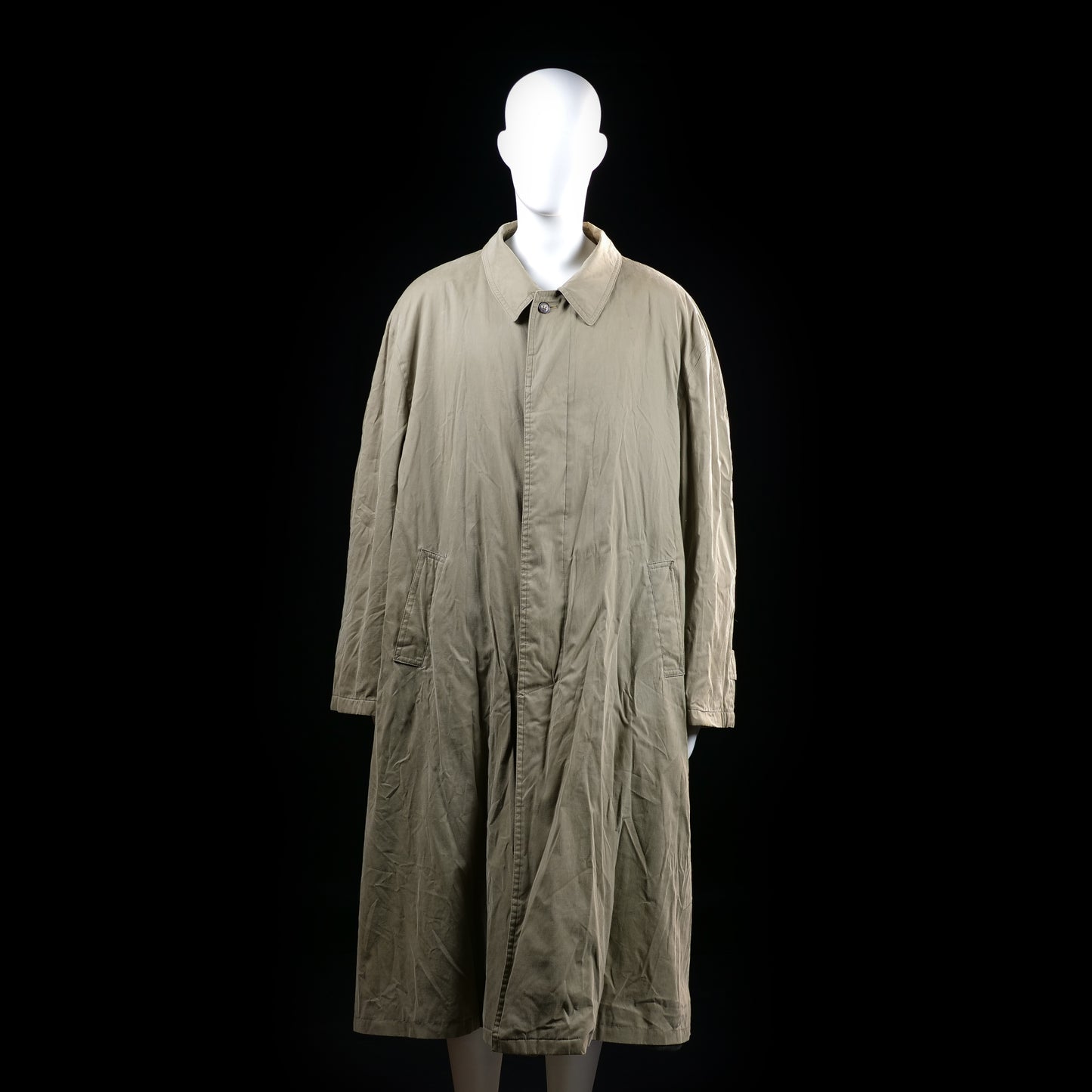 Cerruti 1881 - Trench coat - Taupe - Size 52 - Long coat with a slightly flared silhouette, button front closure, and a storm flap across the upper back. Features adjustable sleeve cuffs and angled front pockets.