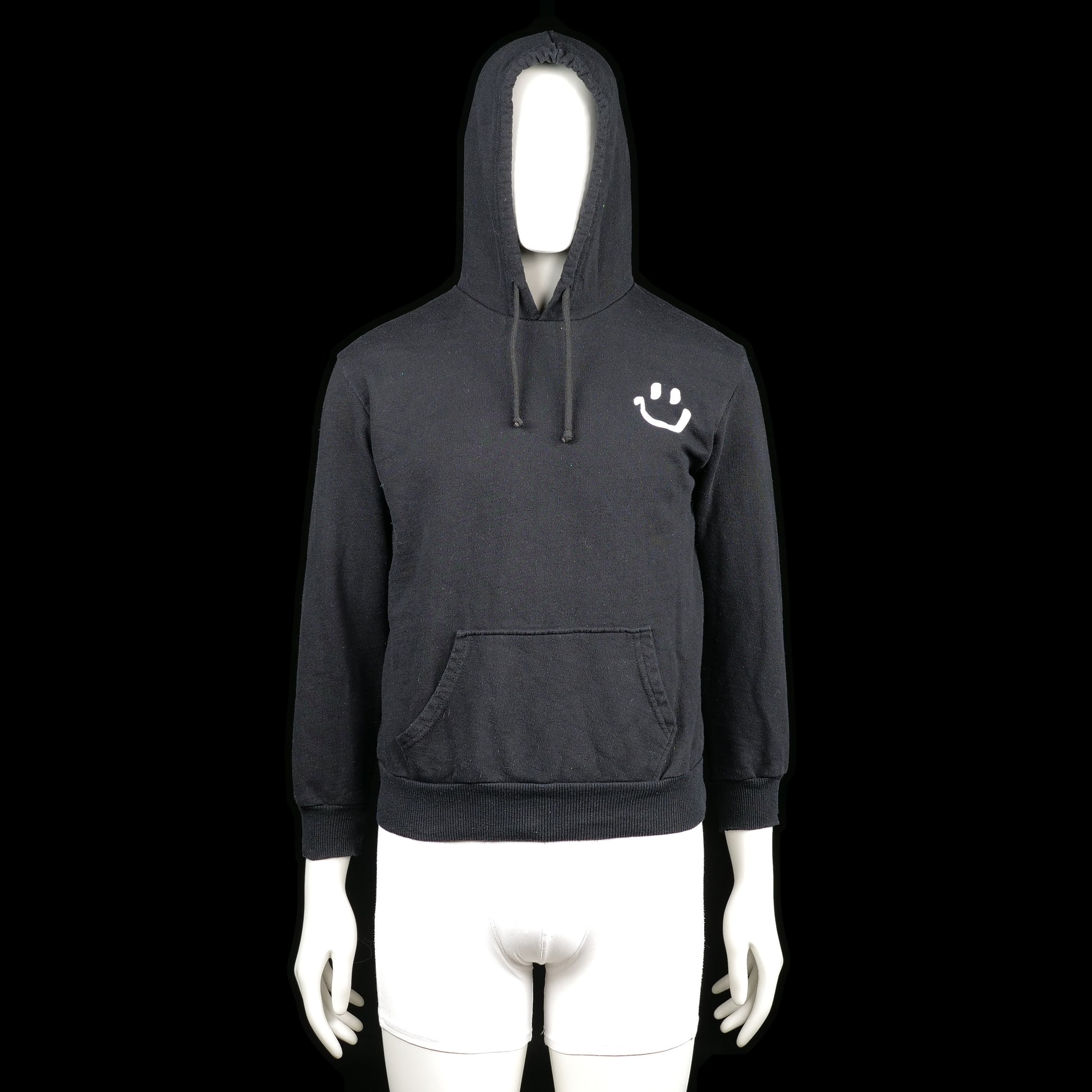 Hoodie - Black & White - Size S - Black hoodie with ribbed cuffs and hem, featuring a white smiley print on the left chest. Includes a front kangaroo pocket and drawstring at the hood.