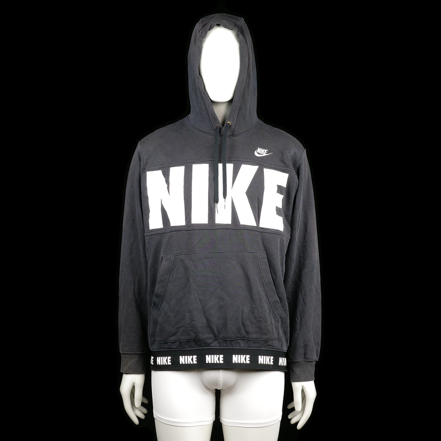 Nike - Hoodie - Black & White - Size L - Black hoodie with large white "NIKE" print across the chest and small logo on the upper chest. The hem features a repeating "NIKE" logo band and it has a front kangaroo pocket.