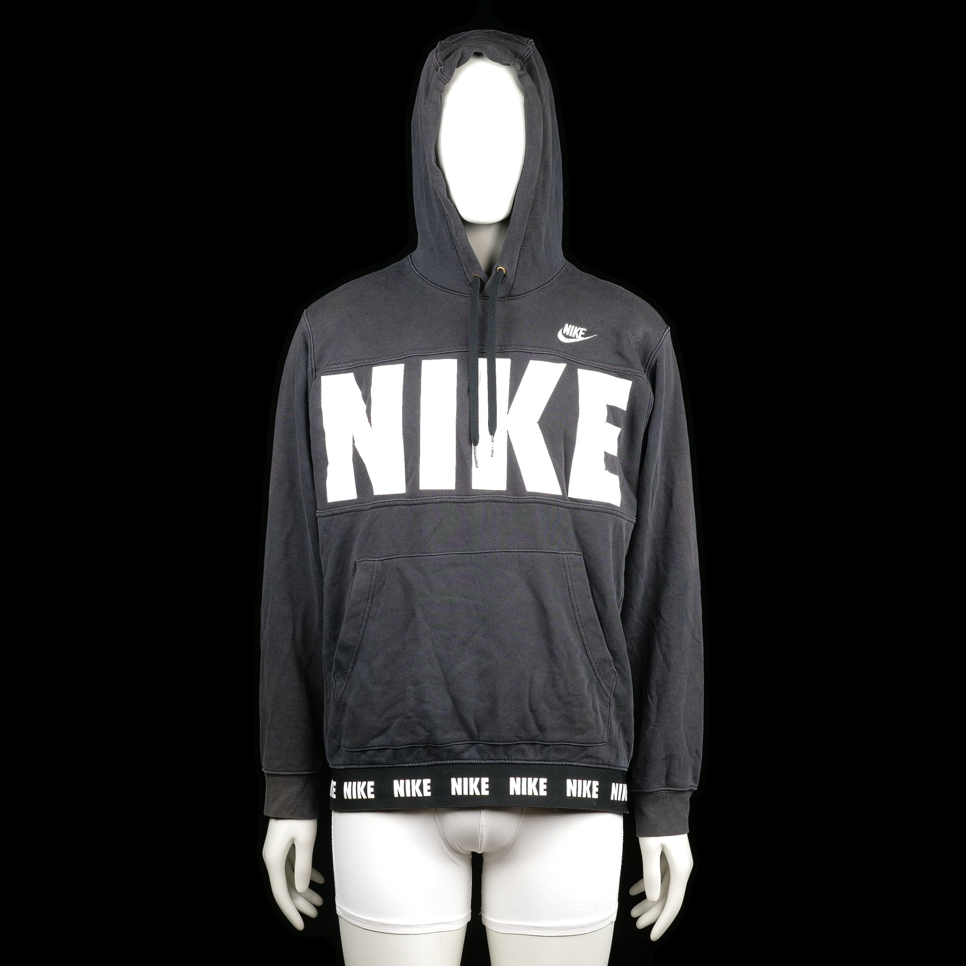 Nike - Hoodie - Black & White - Size L - Black hoodie with large white "NIKE" print across the chest and small logo on the upper chest. The hem features a repeating "NIKE" logo band and it has a front kangaroo pocket.
