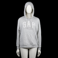 GAP - Hoodie - Light Gray - Size S - Light gray hoodie with ribbed cuffs and a straight hem. Features a floral-textured "GAP" print across the chest and a front kangaroo pocket.