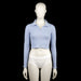 Fb Sister - Polo - Light Blue - Size S - Light blue cropped polo top with ribbed texture, featuring a polo collar and partial front button placket. The sleeves are long with plain cuffs and a straight hem.