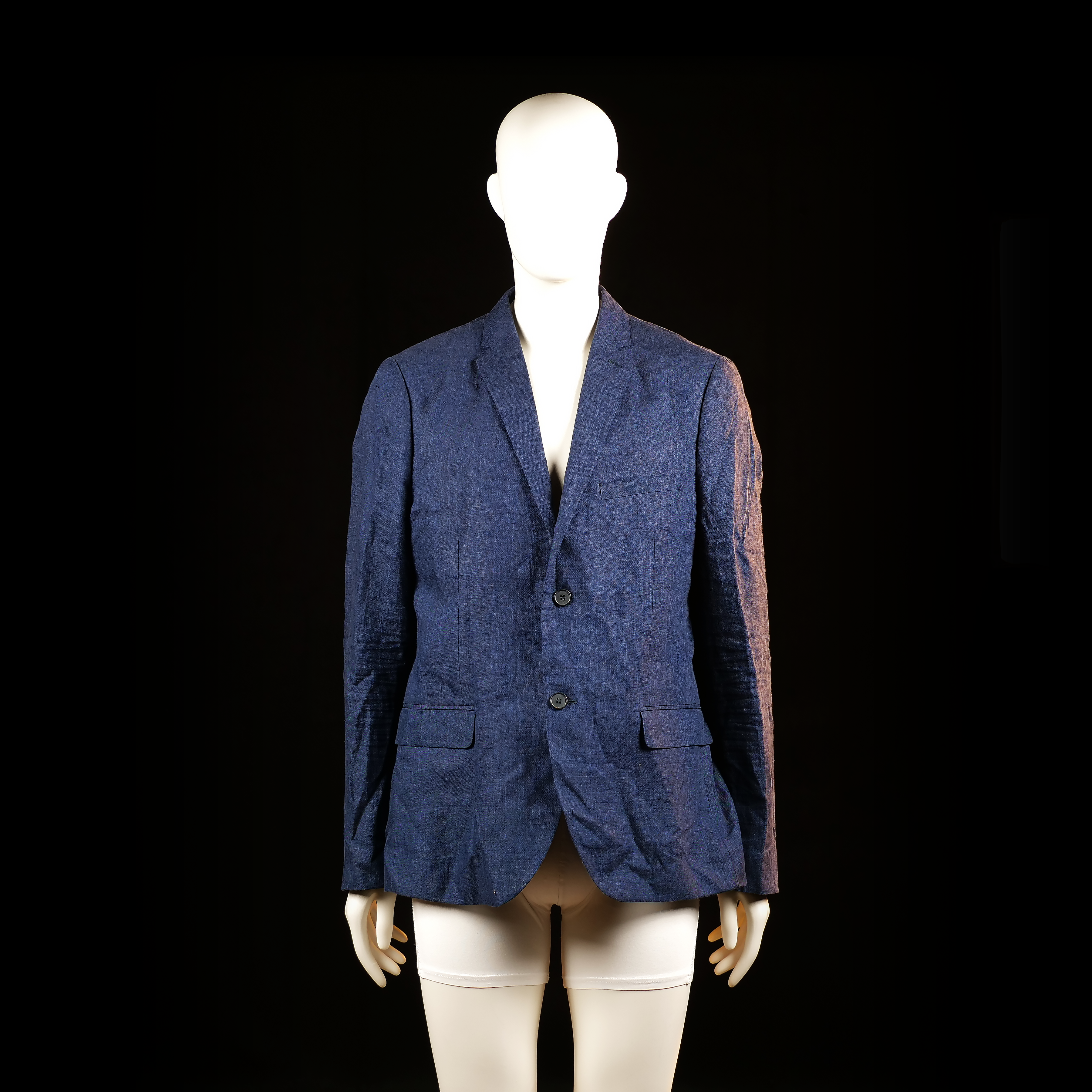 H&M - Blazer - Navy - Size 54 - Two-button single-breasted blazer with a notched lapel, flap pockets, and a chest welt pocket. Visible wrinkling throughout the body and sleeves.