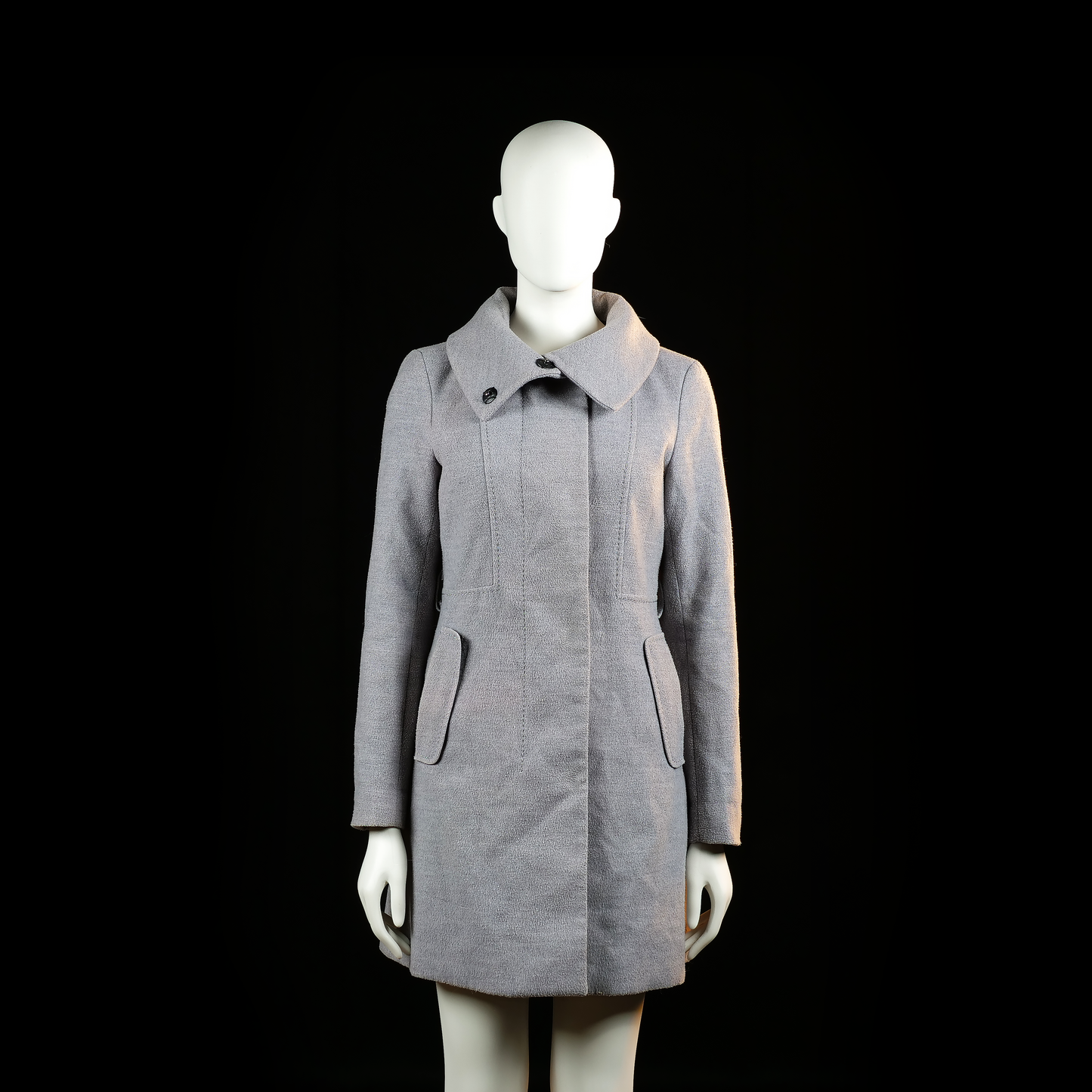 H&M - Overcoat - Light Gray - Size 34 - Light gray coat with a flared hemline, front flap pockets, and a wide high collar secured by an off-center button. Vertical seam detailing runs from the shoulders to the waist.